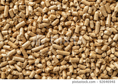 Wood pellets background. Texture of compacted sawdust granules. Wood pellets background. Texture of compacted sawdust granules. 92646948