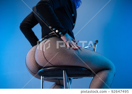 sexy buttocks of a girl in fishnet tights , close-up sexy buttocks of a girl in fishnet tights , close-up 92647495