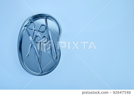 surgical equipment at surgery desk. Medical tools such scissors, scalpel. surgical equipment at surgery desk. Medical tools such scissors, scalpel. 92647598