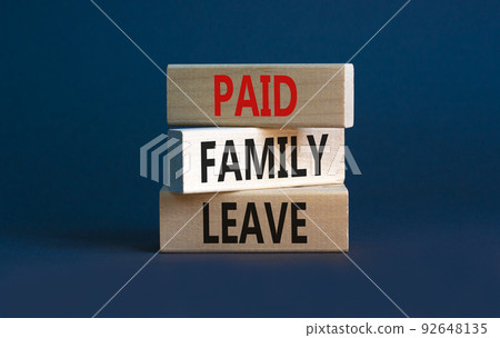 Paid family leave symbol. Concept words Paid family leave on wooden blocks. Beautiful grey table grey background. Business medical and paid family leave concept. Copy space. Paid family leave symbol. Concept words Paid family leave on wooden blocks. Beautiful grey table grey background. Business medical and paid family leave concept. Copy space. 92648135