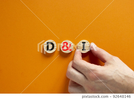 D and I, Diversity and inclusion symbol. Concept words D and I, diversity and inclusion on wooden circles on beautiful orange background. Business, D and I, diversity and inclusion concept. 92648146