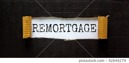 Remortgage symbol. The word 'remortgage' appearing behind torn black paper. Beautiful black background. Business and remortgage concept. Remortgage symbol. The word 'remortgage' appearing behind torn black paper. Beautiful black background. Business and remortgage concept. 92648279
