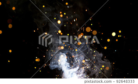 Super Slow Motion of Flying Fire Sparkles. Detail shot, Low Depth of Focus. 92648333