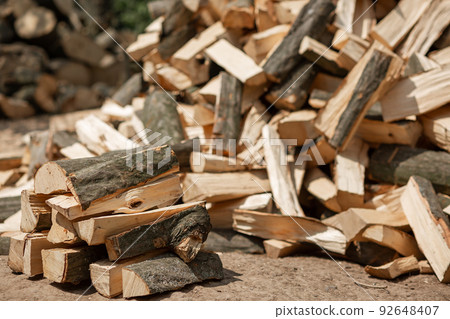 A stacked heap of chopped firewood for the stove. Agriculture 92648407