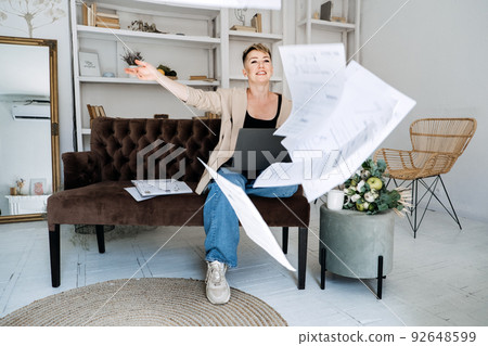 Beautiful hipster woman freelancer copywriter in casual cloth using laptop, writing article Beautiful hipster woman freelancer copywriter in casual cloth using laptop, writing article 92648599