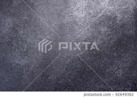 Texture of a concrete wall with cracks and scratches which can be used as a background Texture of a concrete wall with cracks and scratches which can be used as a background 92649362