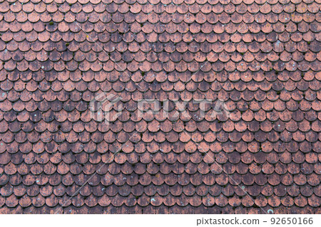 Old roof covered with red tiles for usage as background 92650166
