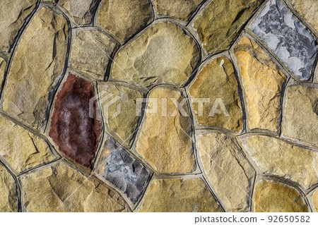 Different sizes of sand stones. Stone wall pattern background Different sizes of sand stones. Stone wall pattern background 92650582