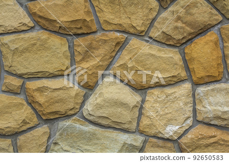 Different sizes of sand stones. Stone wall pattern background Different sizes of sand stones. Stone wall pattern background 92650583
