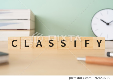 Image of classification and organization | A desk with a block written "CLASSIFY" Image of classification and organization | A desk with a block written "CLASSIFY" 92650729