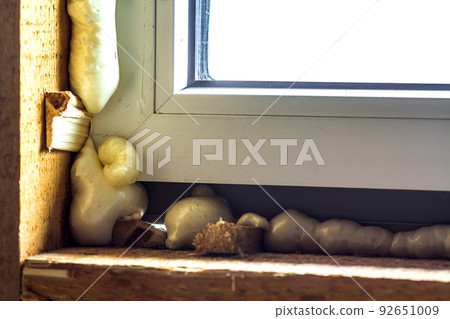 Close-up of new window installation with foam 92651009
