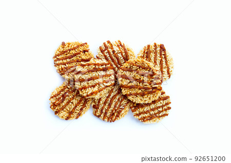 Rice cracker with coconut palm sugar on white Rice cracker with coconut palm sugar on white 92651200