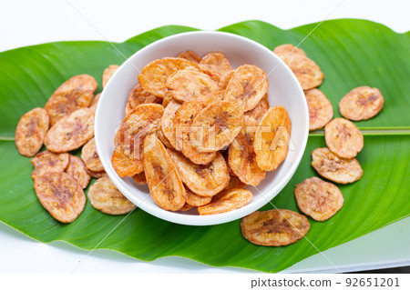 Banana chips on green leaves Banana chips on green leaves 92651201