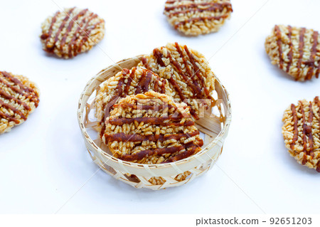 Rice cracker with coconut palm sugar on white Rice cracker with coconut palm sugar on white 92651203