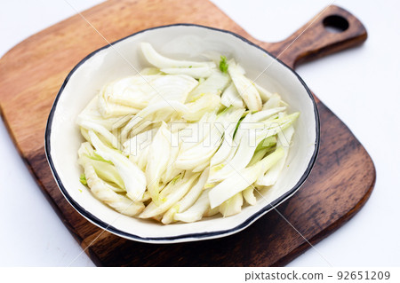Sliced fresh fennel in white bowl Sliced fresh fennel in white bowl 92651209