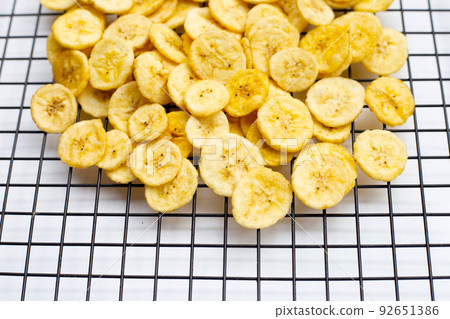 Banana slice chips on white background. Banana slice chips on white background. 92651386