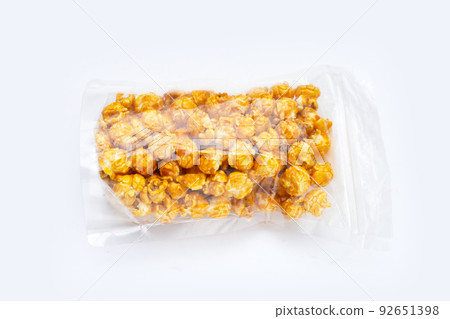 Honey caramel popcorn on white background. 92651398