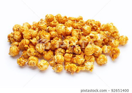 Honey caramel popcorn on white background. Honey caramel popcorn on white background. 92651400