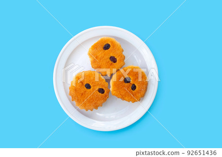 Mini castella cake on blue background. Mini castella cake on blue background. 92651436