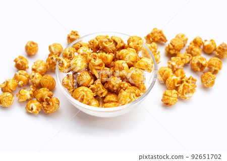 Honey caramel popcorn on white background. 92651702