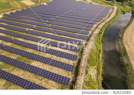 Aerial view of solar power plant. Electric panels for producing clean ecologic energy. Aerial view of solar power plant. Electric panels for producing clean ecologic energy. 92652089