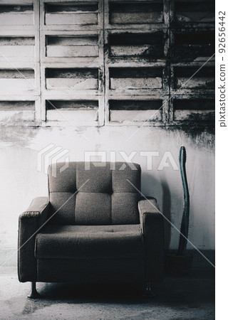 Old sofa in abandoned creepy building 92656442