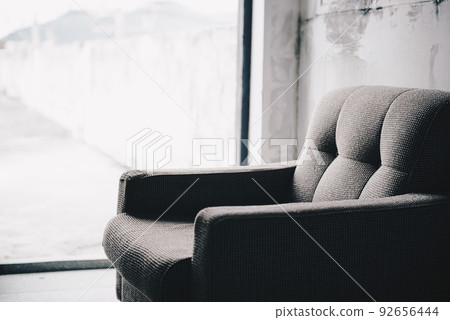 Old sofa in abandoned creepy building 92656444