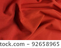 Red galliano fabric crumpled or wavy fabric texture background. Abstract linen cloth soft waves. Viscose yarn. Smooth elegant luxury cloth texture. Concept for banner or advertisement. 92658965