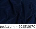 Blue crepe satin crumpled or wavy fabric texture background. Abstract linen cloth soft waves. Silk fabric. Smooth elegant luxury cloth texture. Concept for banner or advertisement. 92658970