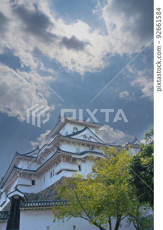 Himeji Castle on a summer day with a few clouds (vertical photo) 92661584