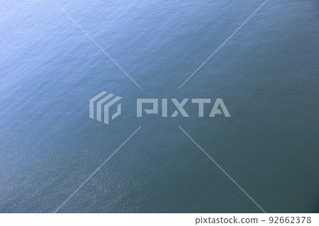 The surface of the water with only a few rippling waves The surface of the water with only a few rippling waves 92662378