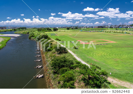 "Tokyo" Blue sky and white clouds, scenery of residential area and Tama River riverbed 92662448