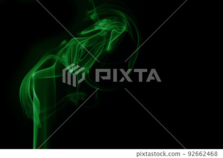Green smoke on black background 92662468