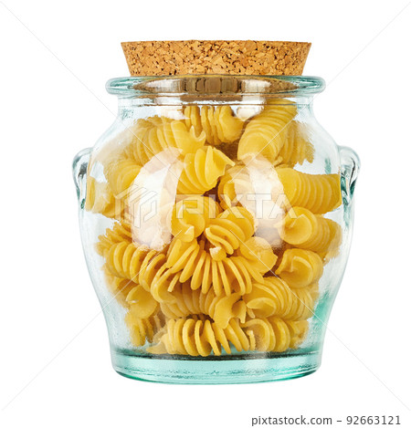 Pasta close-up. Fusilli spirale in a glass jar, isolated on white background. Full depth of field. 92663121