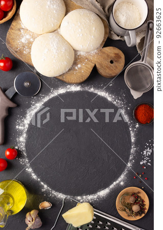 Pizza or dough for bread with ingredients at table. Pizza recipe homemade at tabletop background 92663625