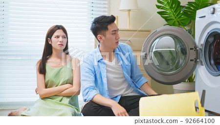 asian housewife angry about laundry 92664100