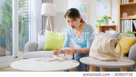 woman calculating bills woman calculating bills 92664730