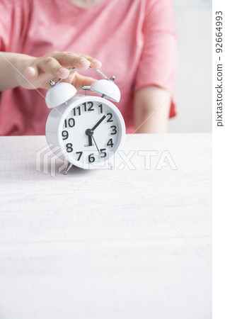 Women's hand to stop the alarm clock Women's hand to stop the alarm clock 92664993