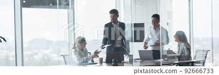 Group of modern, Lawyers, Businesspeople and Investors Gather at the Table in Meeting Room 92666733