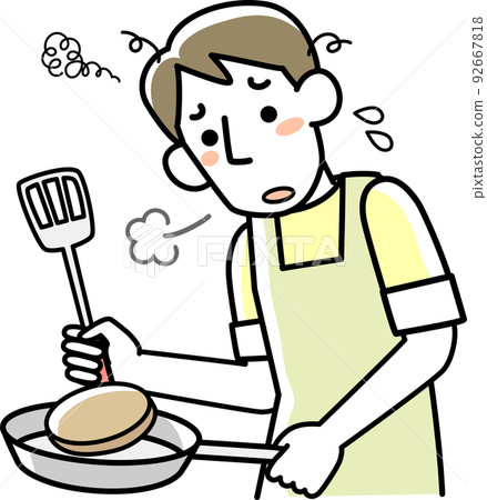 A young man cooking with a tired look 92667818