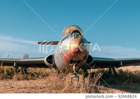 Old L-29 military plane on airbase with blue sky 92668624