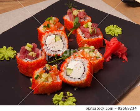sushi rolls with crab, salmon, tuna in tobiko caviar sushi rolls with crab, salmon, tuna in tobiko caviar 92669234