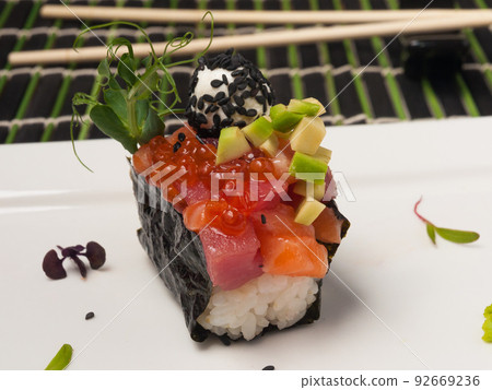 gunkan with salmon, tuna, avocado and red caviar gunkan with salmon, tuna, avocado and red caviar 92669236