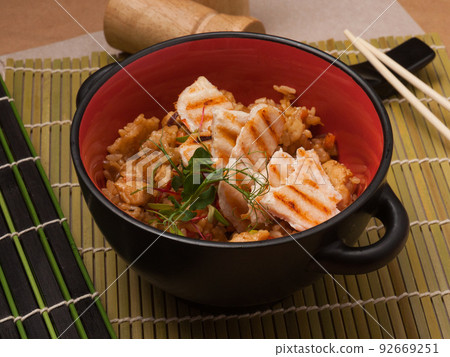 a bowl of garlic rice with chicken. japanese cuisine a bowl of garlic rice with chicken. japanese cuisine 92669251