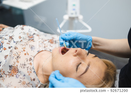 Dentist injection anesthetic using modern STA method. Pain free dental treatment 92671200