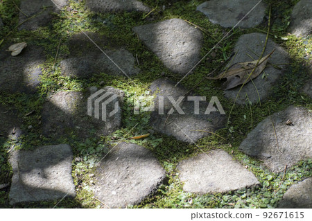 The ground paved with stones in the summer sun 92671615