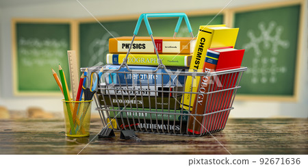 Back to school supplies. Books in a shopping basket, pencils on a desk in classroom. Back to school supplies. Books in a shopping basket, pencils on a desk in classroom. 92671636