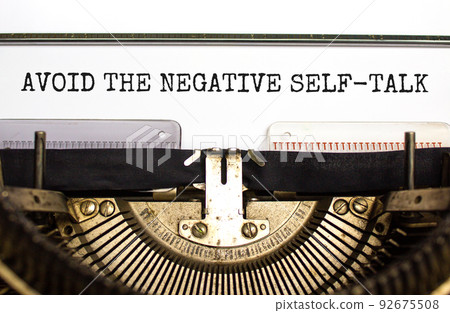 Avoid negative self-talk symbol. Concept words Avoid the negative self-talk typed on old retro typewriter. Beautiful white background. Psychological and Avoid negative self-talk concept. Copy space. 92675508
