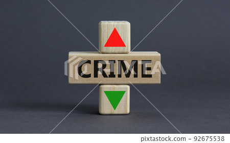 Crime rate symbol. A wooden cubes with up arrow. Wooden block with the concept word Crime. Beautiful grey table grey background. Business and crime rate concept. Copy space. Crime rate symbol. A wooden cubes with up arrow. Wooden block with the concept word Crime. Beautiful grey table grey background. Business and crime rate concept. Copy space. 92675538