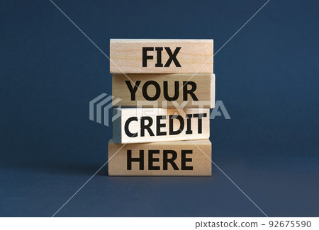 Fix your credit here symbol. Concept words Fix your credit here on wooden blocks on a beautiful grey table grey background. Business, finacial and fix your credit here concept. Fix your credit here symbol. Concept words Fix your credit here on wooden blocks on a beautiful grey table grey background. Business, finacial and fix your credit here concept. 92675590